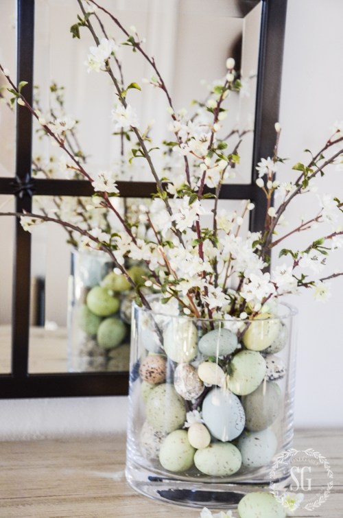spring decor idea twigs and faux eggs