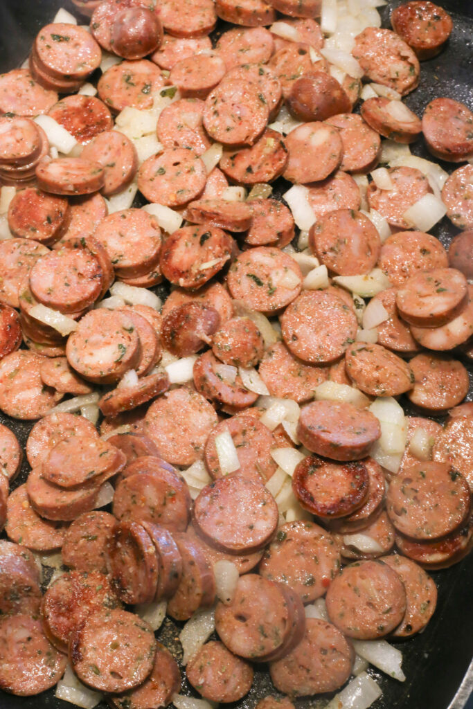 seared chicken sausage with onion.