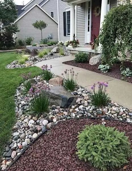 rock bed landscaping around the house